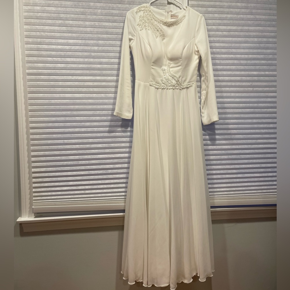 Modest white dress with long sleeves